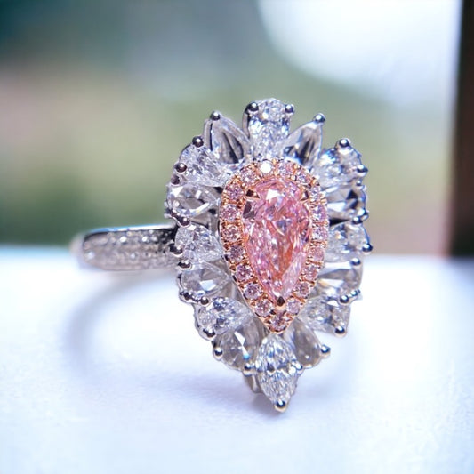 Pink diamond ring on the white table 