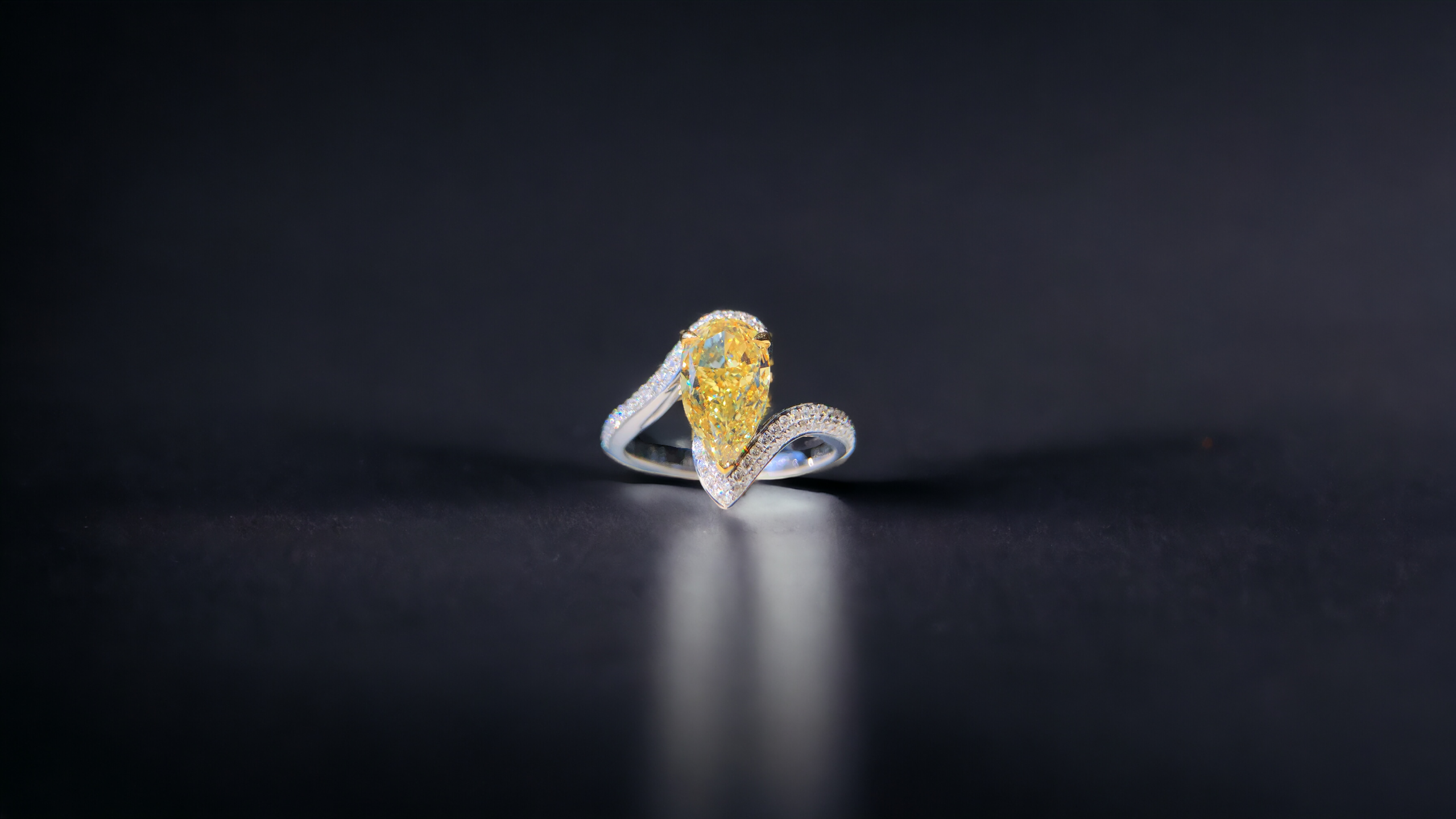 A Unique Pear Cut Yellow Diamond Ring